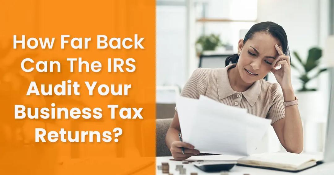 Woman reviewing documents at a desk with a text overlay asking "how far back can the irs audit your business tax returns?" in a home office setting.