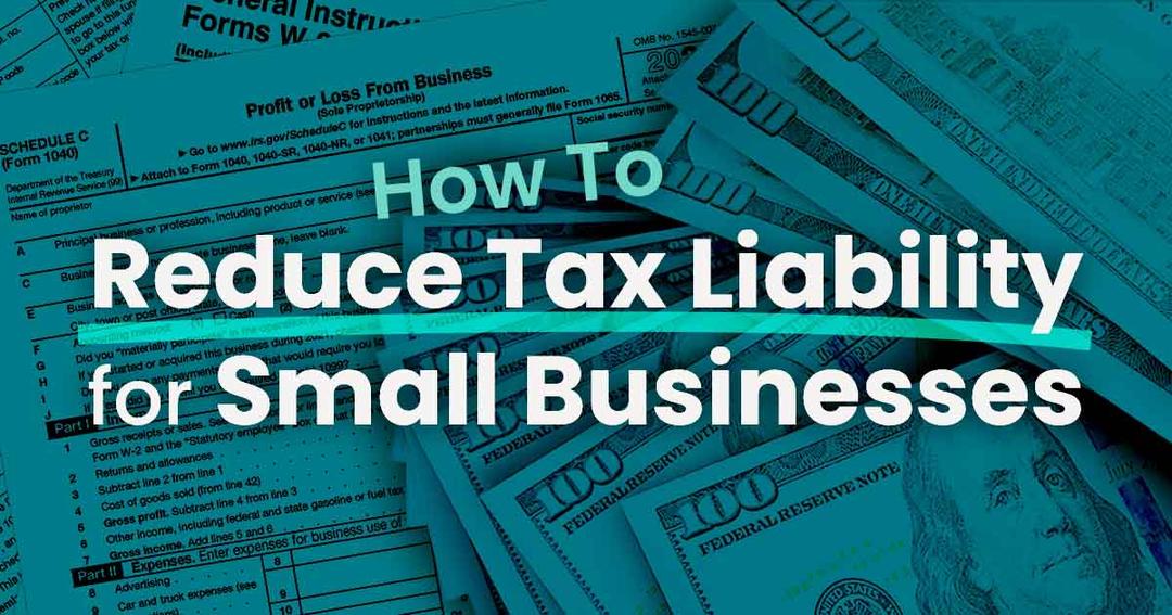 One hundred dollar bills laying on top small business tax forms as the business owner ponders how to reduce their tax liability.