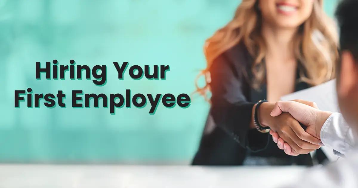 Text reads "Hiring Your First Employee". A person with long hair shakes hands with another person, who is partially out of the frame, against a blurred background.