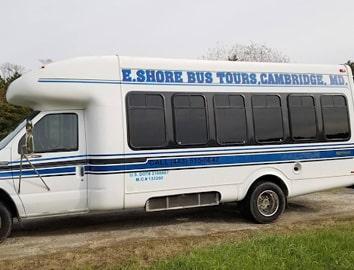 E. Shore Bus Tours bus on a dirt road